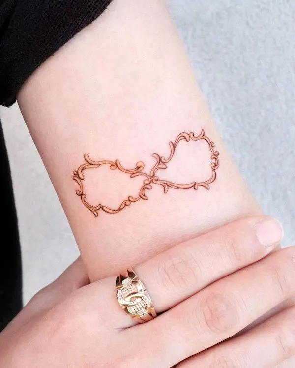 Antique ornamental infinity tattoo by @tattooist_solar