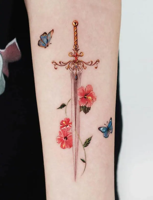 Beautiful flowers and butterfly sword tattoo by @jooa_tattoo