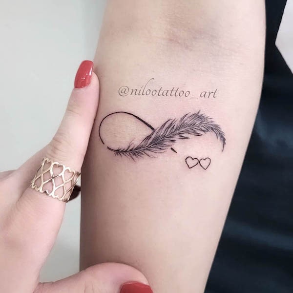 Danish Tattooz House  Beautiful infinity tattoo  Infinity tattoo with love  life written and a feather Describes the presence of mind within In the  tattoo world this can be seen as