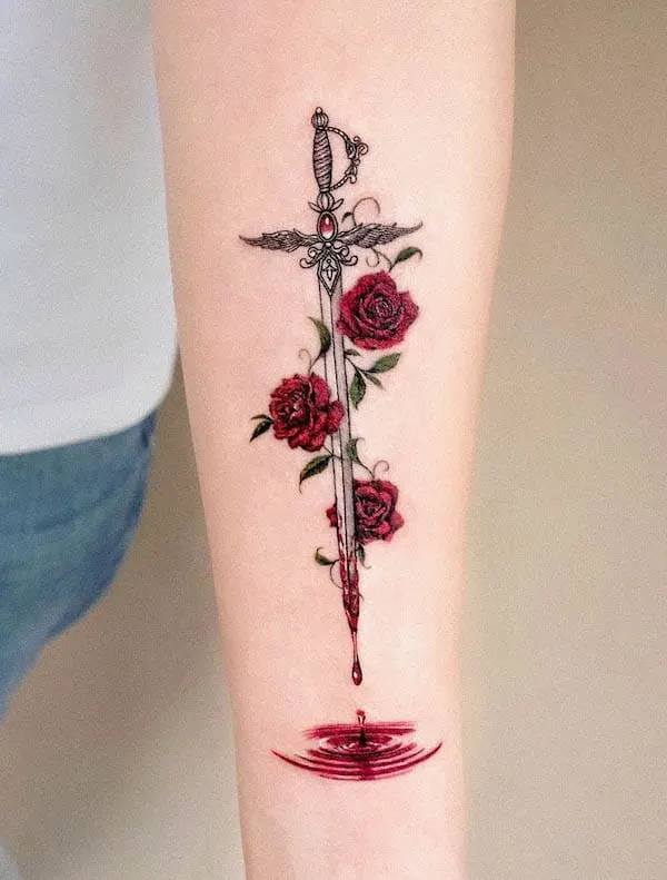 Bleeding sword with roses by @tattooist_solar