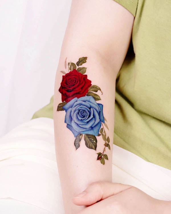 Blue and red rose arm tattoo by @peria_tattoo