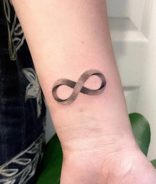 Bold infinity wrist tattoo by @jins_tattoo