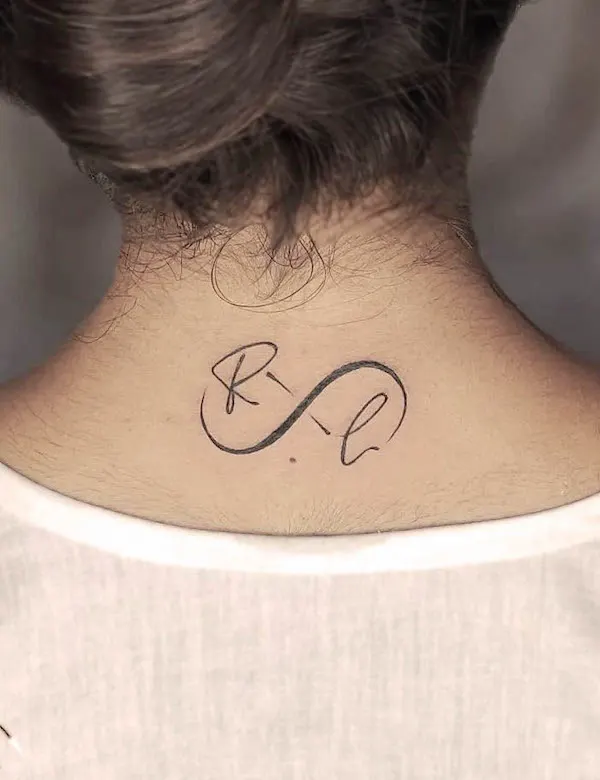 Bold initial infinity neck tattoo by @rascalinktattoos