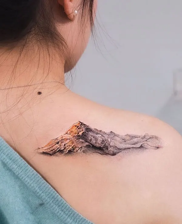 Bold mountain shoulder tattoo by @goldeniron_tattoos_toronto