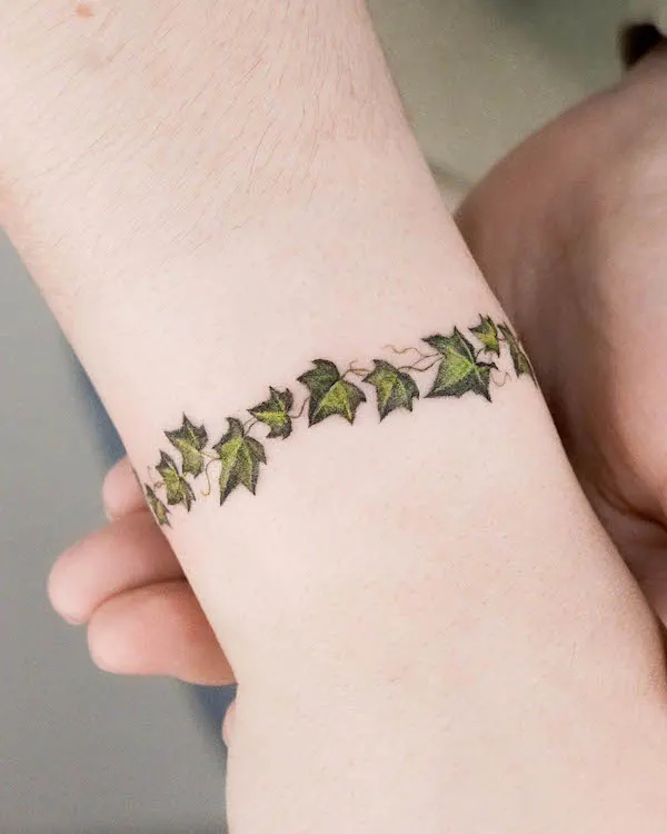 Cute leaves bracelet tattoo by @zihong_tattoo