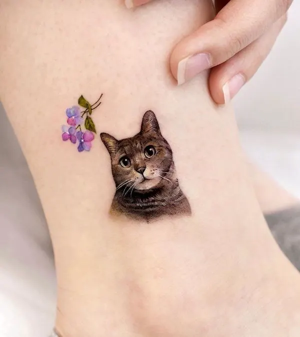 Cute small cat ankle tattoo by @songe.tattoo.jpg