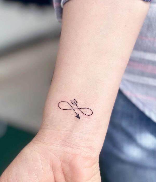 Side tattoo of a infinity symbol that includes an