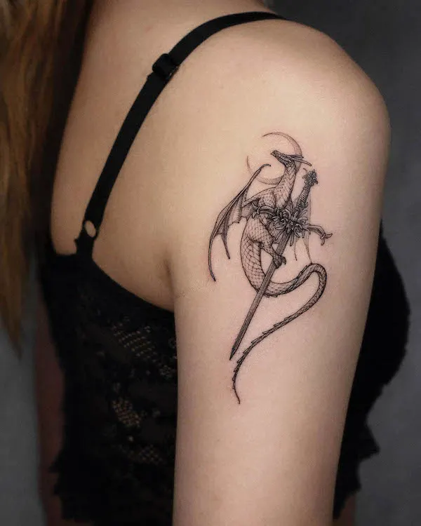Elegant dragon and sword shoulder tattoo by @tattooer_intat