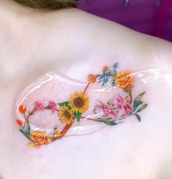 Floral infinity collarbone tattoo by @blckpich_studio