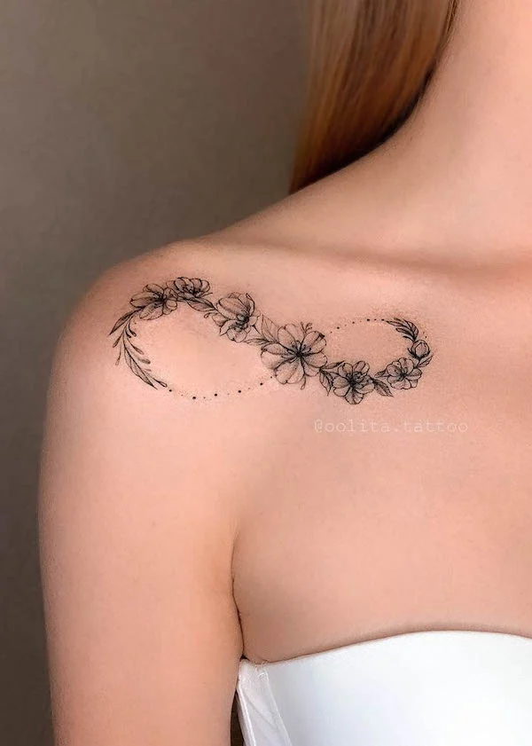Floral infinity collarbone tattoo by @oolita.tattoo