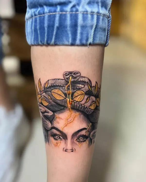 Golden Medusa calf tattoo by @dannytatt00