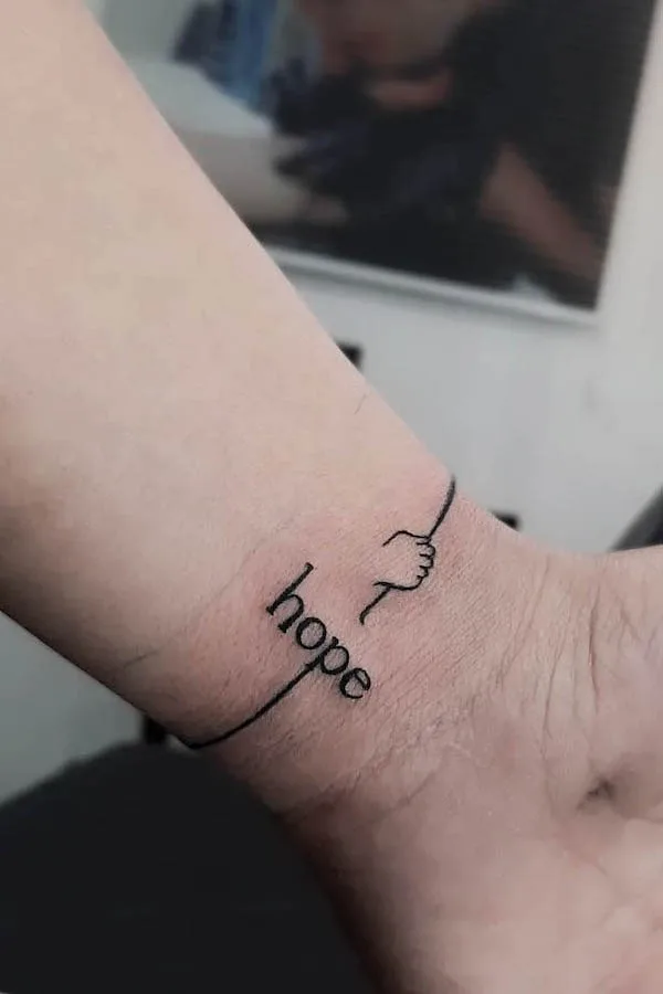 Hope one-word tattoo by @soji_tattoo