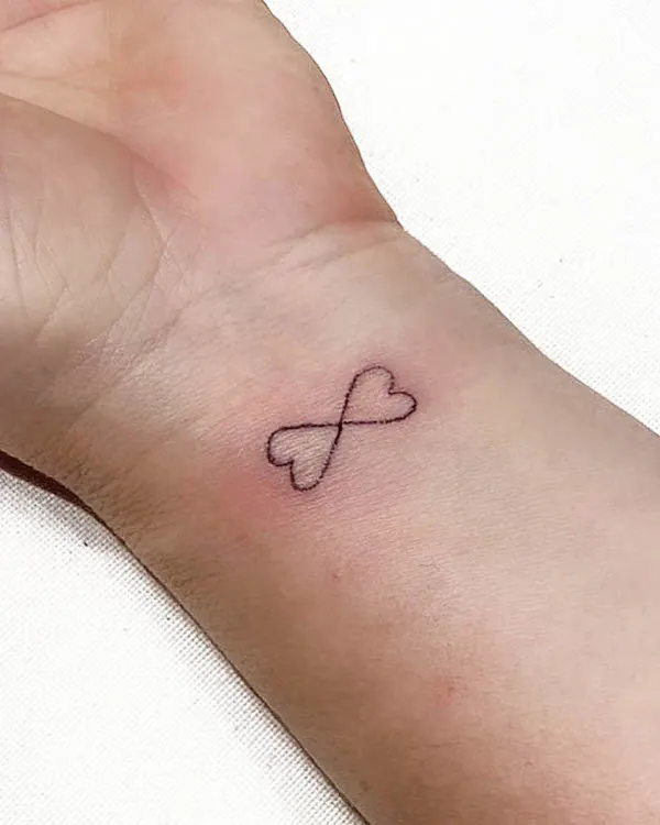 Infinity hearts wrist tattoo by @amar.natbagatini