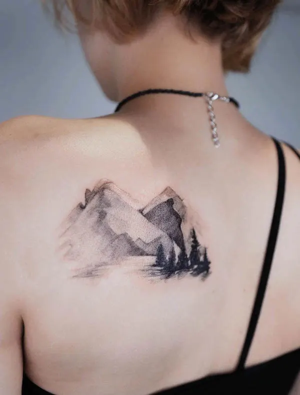 Ink wash painting style mountain tattoo by @narrtats