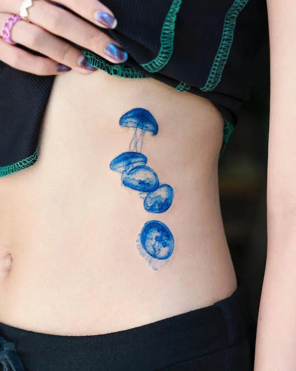 Jelly fish rib tattoo by @pokhy_tattoo