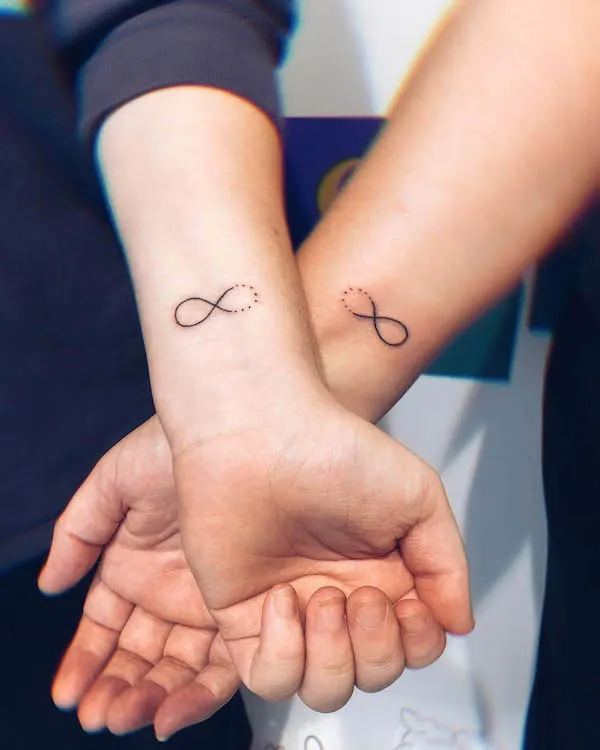 Matching infinity tattoos by @stayte_of_art