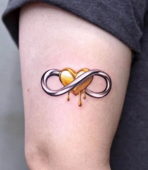 Metallic infinity and heart tattoo by @inkflow_akiwong