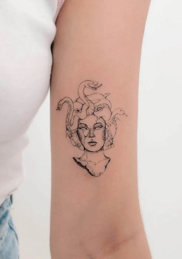 Simple Medusa bicep tattoo by @bellafineline