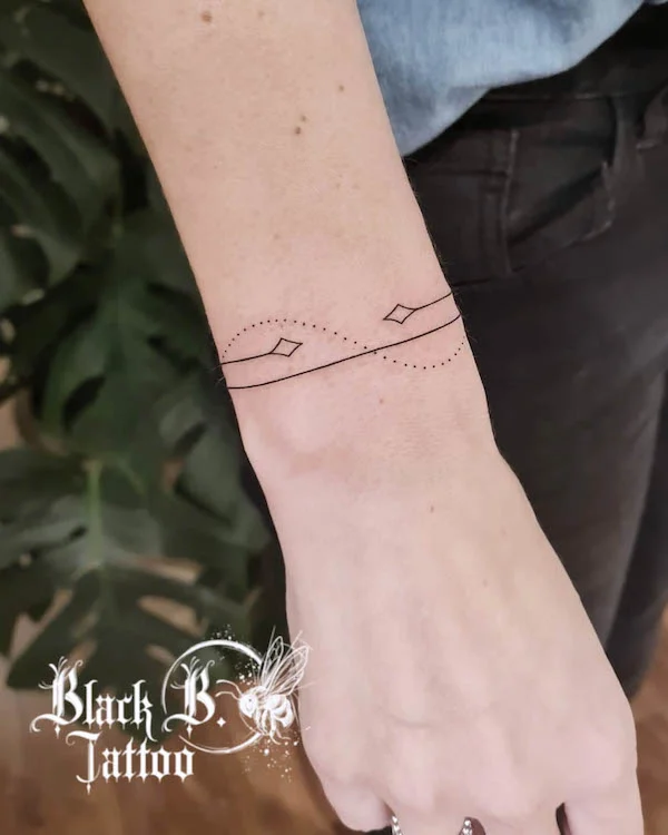 Simple bracelet tattoo by @britt_blackbtattoo