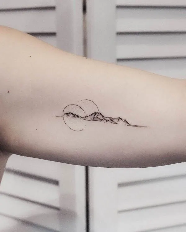 Simple mountain bicep tattoo by @tavi_tattoo