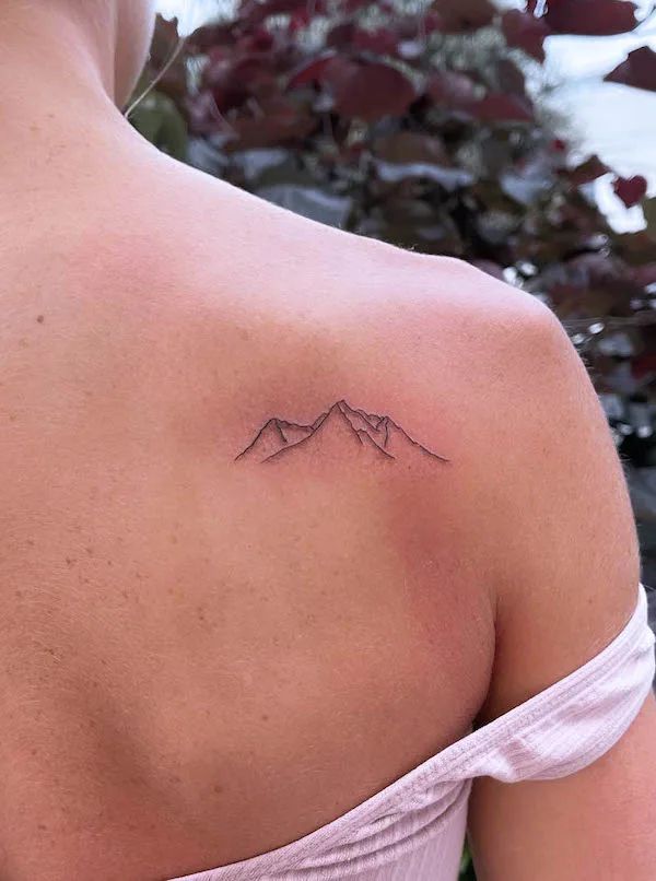 Simple mountain tattoo on the shoulder blade by @michaela_mb_art