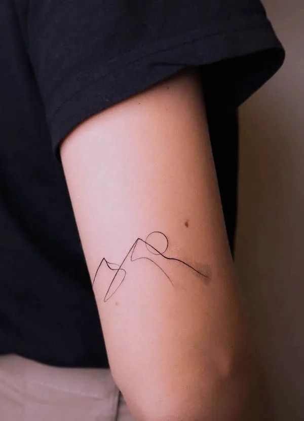 Simple sun and mountain tattoo by @janapadar