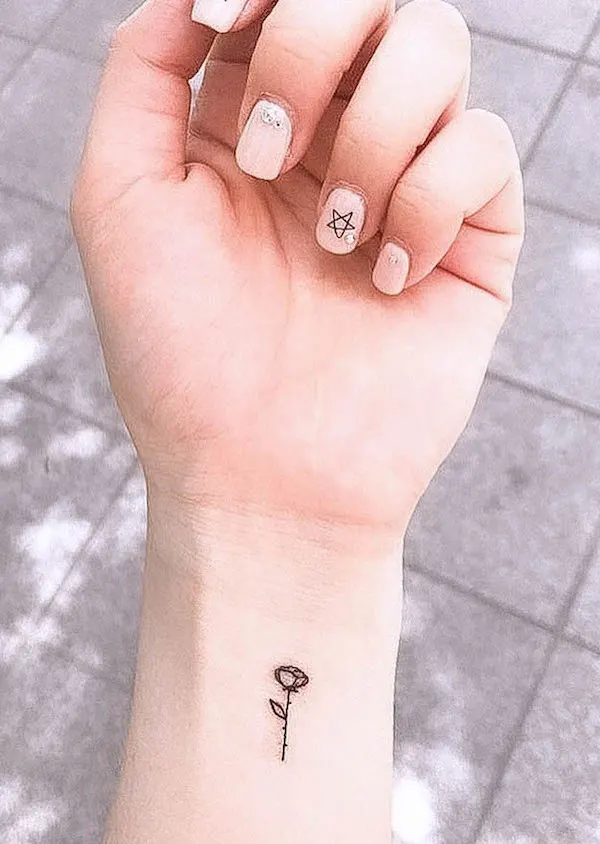 Tiny rose tattoo by Mallory Swinchock TattooNOW