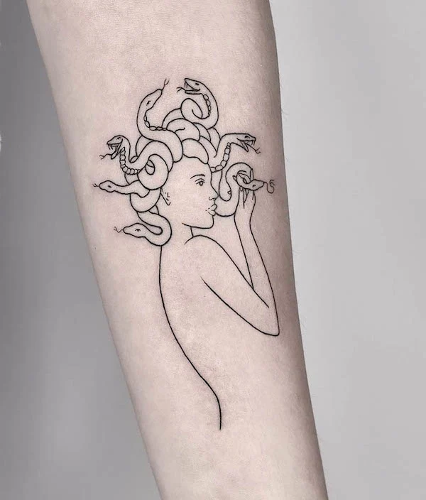 Sleek Medusa fine line tattoo by @salamon.peti_