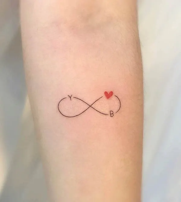 Small and simple infinity initial tattoo by @tattooist_neul