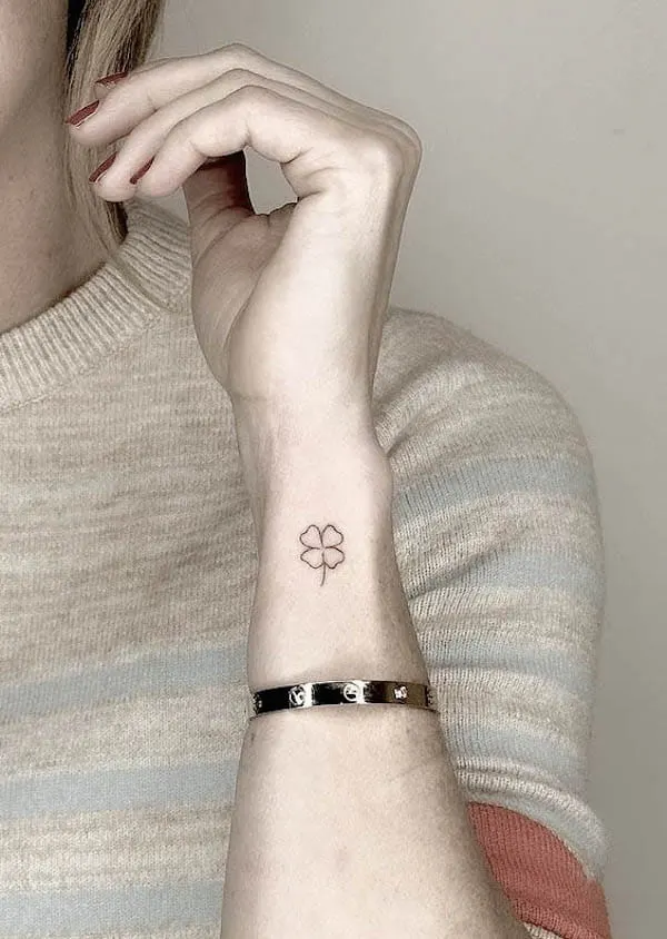 Small four leaf clover wrist tattoo by @tattoobychang.jpg