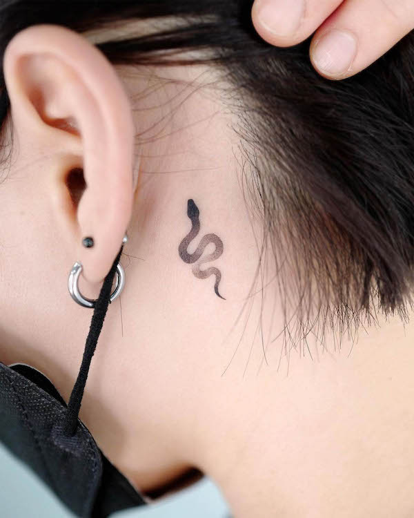 Small snake behind the ear tattoo by @choiyun_tattoo