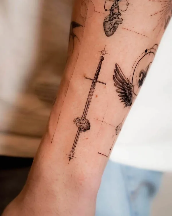 Small sword wrist tattoo by @tattooist_fini