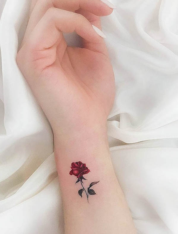 Small red rose wrist tattoo by @small_tattoo