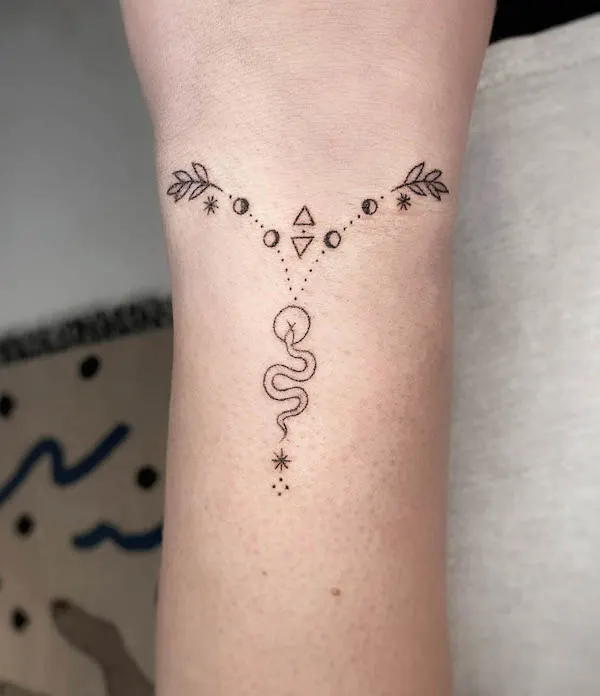 Small snake geometric bracelet tattoo by @trikona.tattoos
