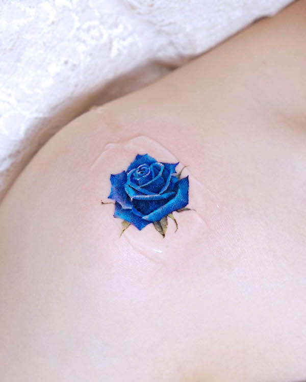 Stunning blue rose shoulder tattoo by @tilda_tattoo