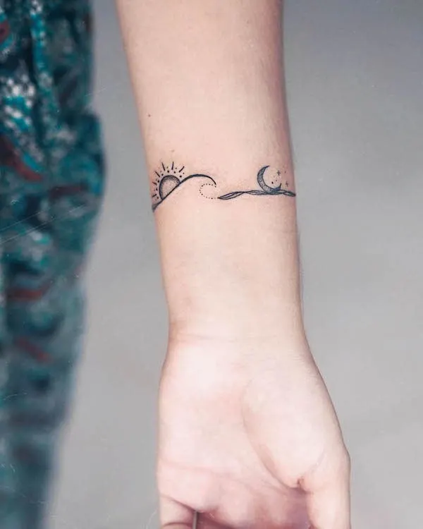 Sun, moon and waves wrist tattoo by @zmfreespirit