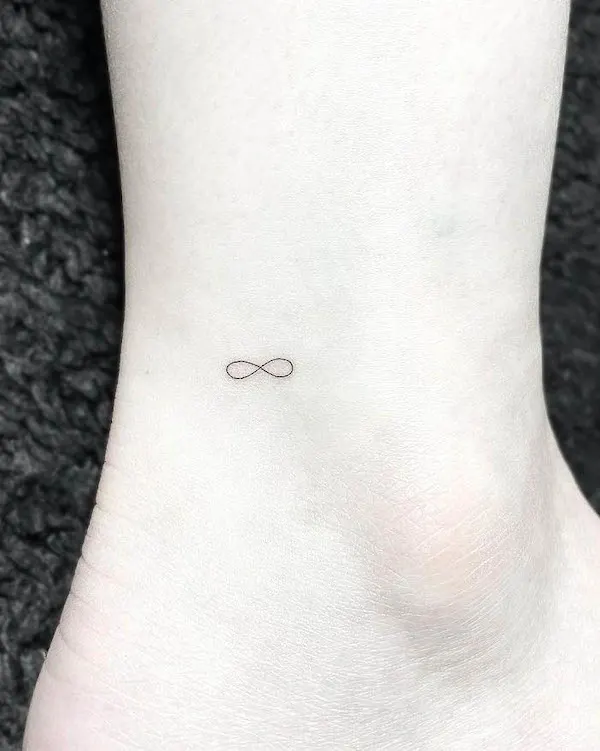 Super small infinity ankle tattoo by @sop_tattoo