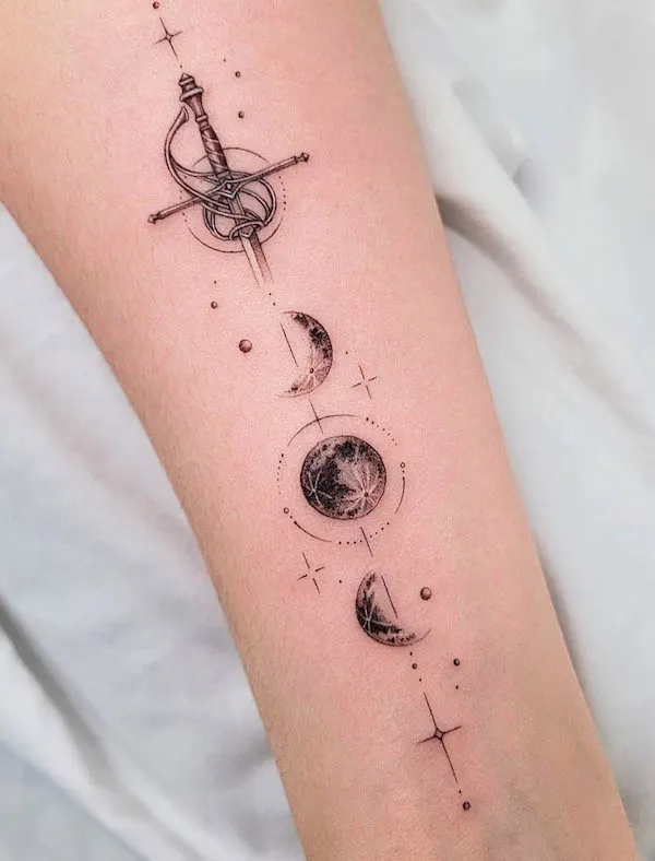 Sword and moon phase tattoo by @dan_tattooer