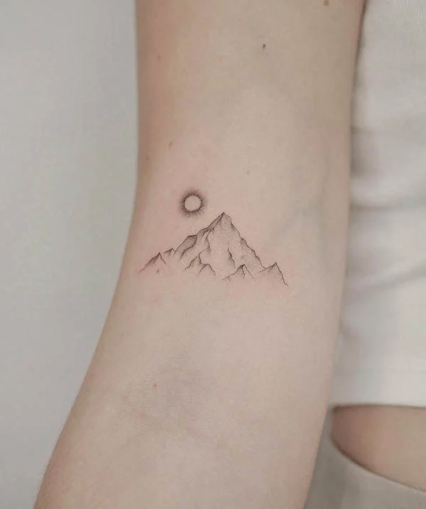 The rising sun mountain tattoo by @tattooist_veronik