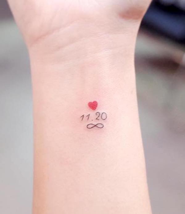 Tiny infinity tattoo with date by @wittybutton_tattoo