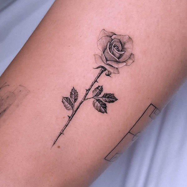 Tiny realism black and grey rose tattoo by @fuhrichtattoo
