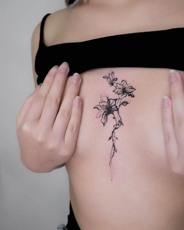 Abstract flowers sternum to chest tattoo by @o___sim