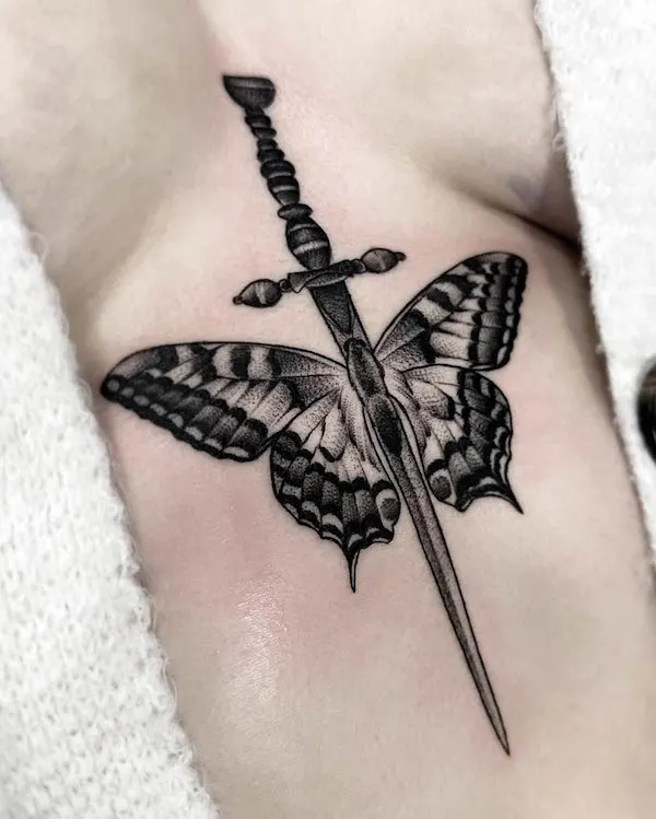 Sword butterfly tattoo sternum