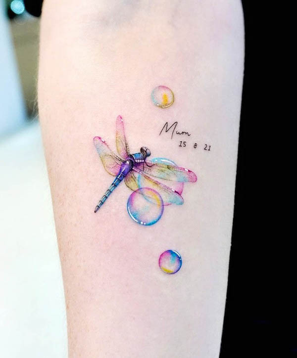 Colorful dragonfly tattoo with bubbles by @kico.tattoo