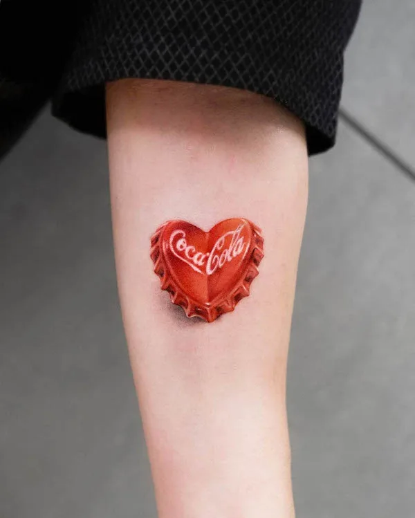 Creative coca cola heart forearm tattoo by @neuneu_tattooer
