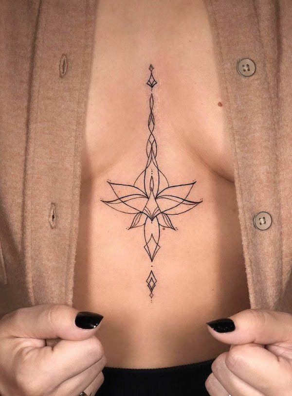 Fine line lotus underboob tattoo by @morika.ink