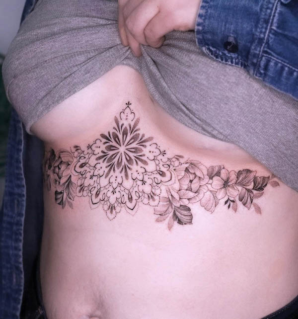 Flowers and floral mandala underboob tattoo by @amybillingtattoo
