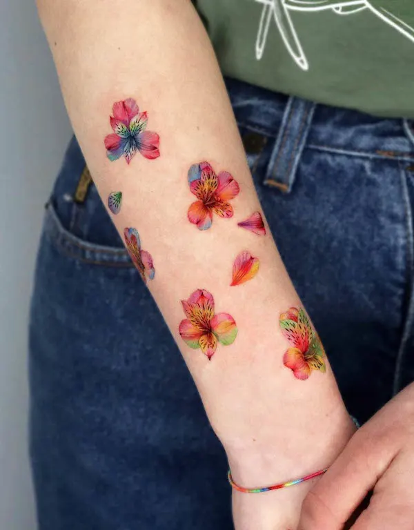 Flowers and petals forearm tattoo for women by @non_lee_ink