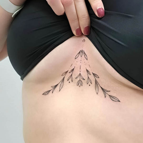 Geometric flower underboob tattoo by @inuk.tattoo