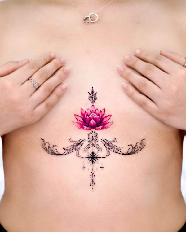 Koi fish and lotus underboob tattoo by @hwyl.tattoo